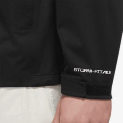 Nike Storm-FIT ADV Waterproof Golf Jacket -FootJ Golf Club Shop Nike Golf AW22 Storm Fit ADV Waterproof Jacket DN1955 010 WJNIK058 Black White Model 2